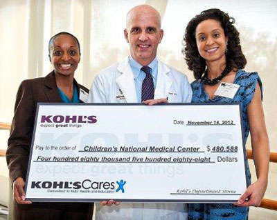 Kohl's presents their check to Drs. Harris, Teach and White