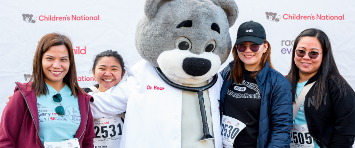 Dr. Bear posing with team on Race day