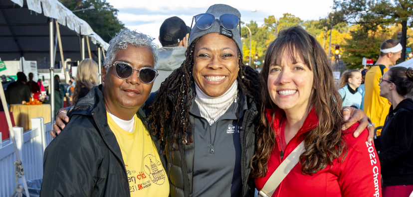 Volunteers smiling together at last year's Race
